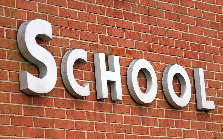 End of School Year, school building with sign